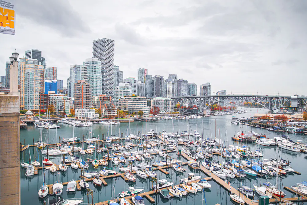 Boats in False Creek marina beneath the Vancouver skyline